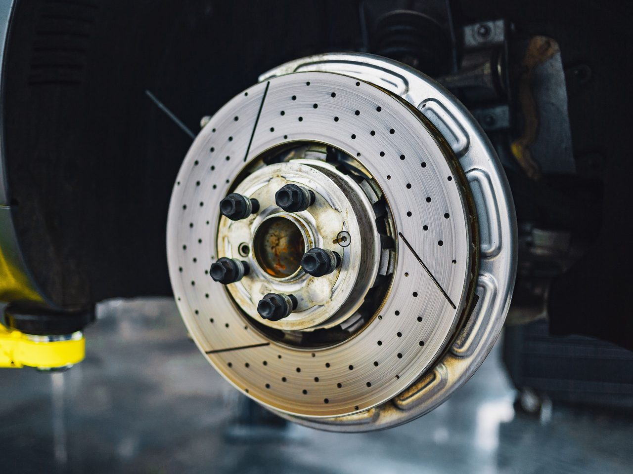 Performance brake disc exposed for workshop inspection.